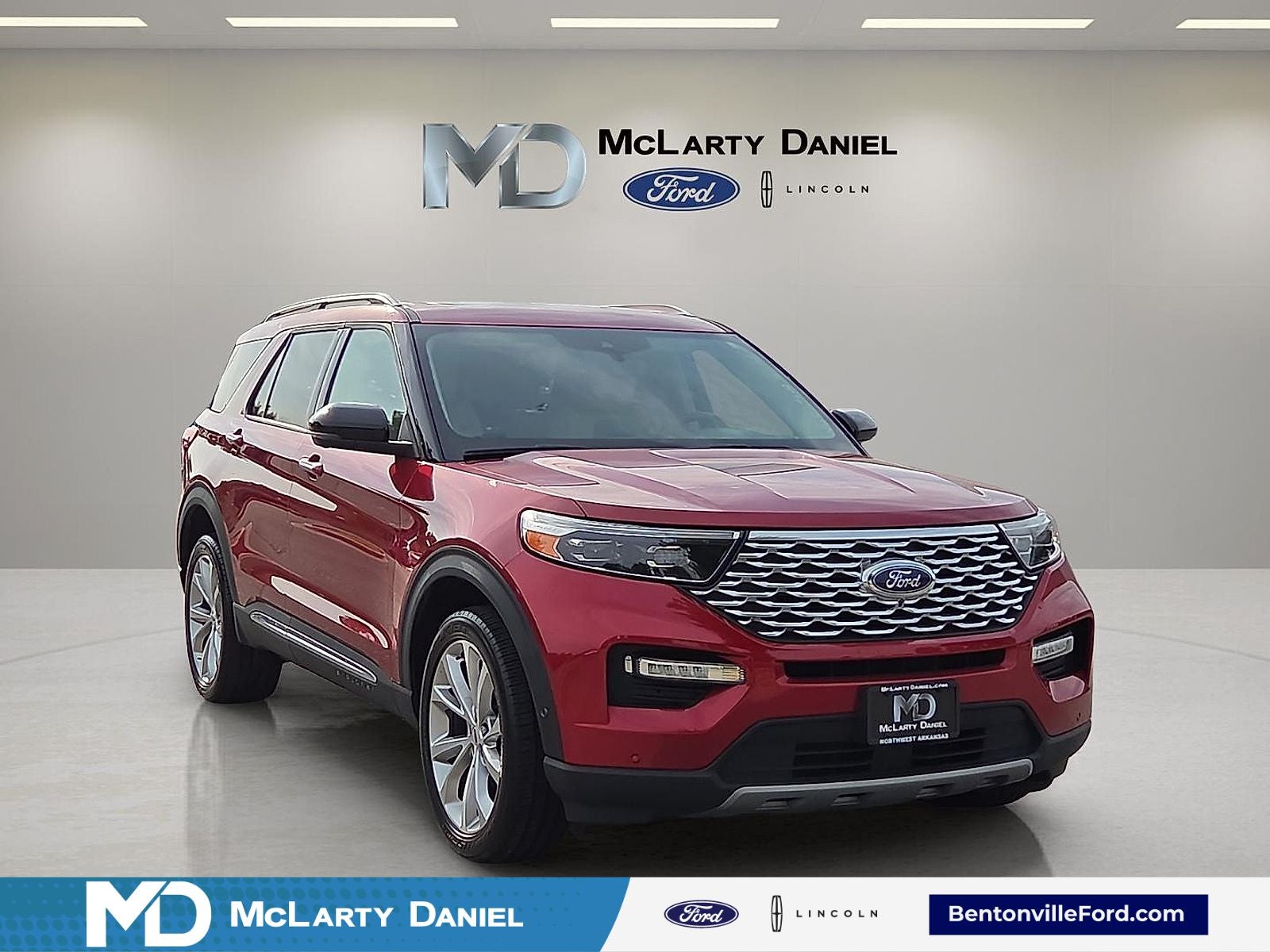 2022 Ford Explorer Platinum in Rapid Red Metallic Tinted Clearcoat — front three-quarter view