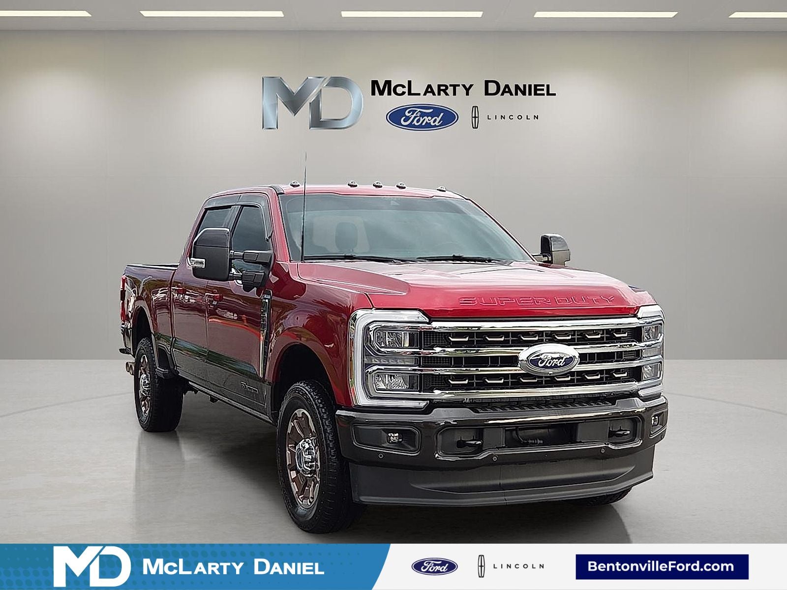 2025 Ford F-250SD King Ranch in Ruby Red Met Tinted Cc — front three-quarter view