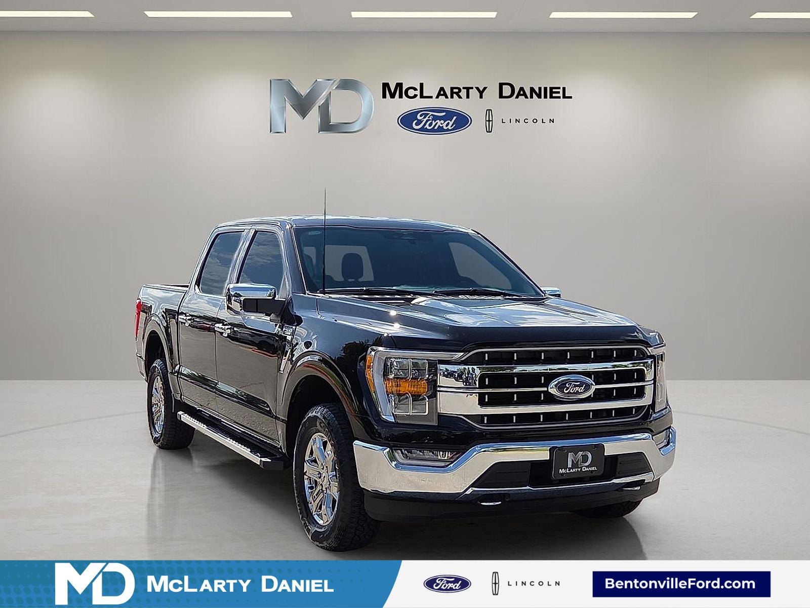 2023 Ford F-150 Lariat in Black Metallic — front three-quarter view