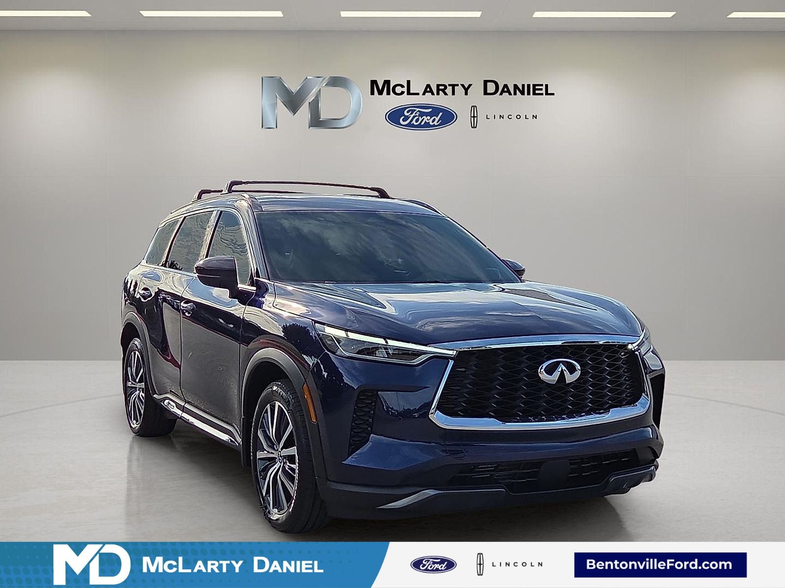 2025 INFINITI QX60 Autograph in Grand Blue — front three-quarter view